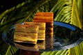 Bebinca, traditional Goan dessert from coconut milk dough, sweet Indian pudding on a metal plate, close up. Goan-Portuguese pie, Royalty Free Stock Photo