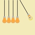 Hanging light bulbs in perpetual motion one of them with artificial intelligence symbol on it Royalty Free Stock Photo