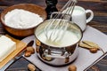 Bechamel sauce in a pan and ingredients Royalty Free Stock Photo