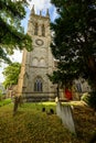 St George`s Church in Beckenham with the square church tower and churchyard with gravestones.