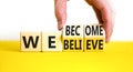 We become or believe symbol. Concept word We believe We become on wooden cubes. Beautiful yellow table white background. Royalty Free Stock Photo