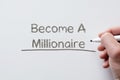 Become a millionaire written on whiteboard Royalty Free Stock Photo