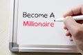 Become a millionaire written on whiteboard Royalty Free Stock Photo