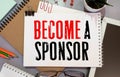 Become a Sponsor text, business concept on white paper Royalty Free Stock Photo