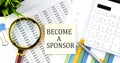 BECOME A SPONSOR text on sticker on diagram with magnifier and calculator. Business concept