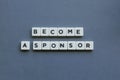 ' Become A Sponsor ' word made of square letter word on grey background