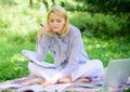 Become successful freelancer. Woman with laptop sit on rug grass meadow. Girl with notepad write note. Business lady