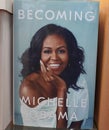 Becoming book written by Michelle Obama at the bookstore. books by Michelle Obama displayed on the shelves of a book shop. Library