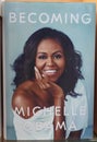 Becoming book written by Michelle Obama at the bookstore. books by Michelle Obama displayed on the shelves of a book shop. Library