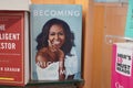 Becoming book written by Michelle Obama at the bookstore. books by Michelle Obama displayed on the shelves of a book shop. Library