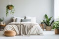 Bed against of grey empty wall with copy space. Nordic interior design of modern bedroom with greenery. Created with generative AI Royalty Free Stock Photo