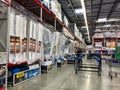 The bed aisle of a Sams Club with variety of mattresses