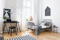 Bed and black chair at desk in kid`s room interior Royalty Free Stock Photo