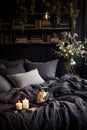 Bed With Black Comforter and Two Candles