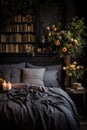 Bed With Black Comforter and Vase of Flowers