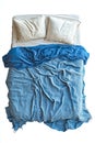 A bed with a blue blanket on top of it Royalty Free Stock Photo