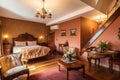 bed and breakfast with warm decor, comfortable armchairs, and cozy atmosphere