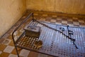 Bed in a cell in Tuol Sleng (S21) Prison Royalty Free Stock Photo