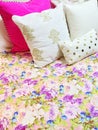 Bed with colorful floral design bedclothes Royalty Free Stock Photo