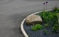 A bed of colorful prairie flowers in an urban environment attractive to insects and butterflies, mulched by gravel. on the corners Royalty Free Stock Photo