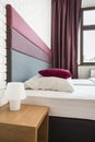 Bed with colourful headboard Royalty Free Stock Photo