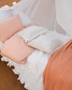 Bed with decorative pillows and duvet .Outdoor. Spring. Relaxation.