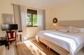 Bed and desk inside master bedroom in a villa