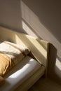 Bed in evening light Royalty Free Stock Photo