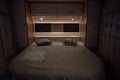 Bed inside a new luxury camper van motorhome Royalty Free Stock Photo