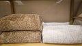 Bed linens, pillows, textiles and towels on a shelf Royalty Free Stock Photo
