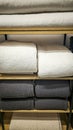 Bed linens, pillows, textiles and towels on a shelf Royalty Free Stock Photo