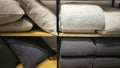 Bed linens, pillows, textiles and towels on a shelf Royalty Free Stock Photo