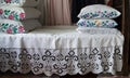 Bed made with embroidered sheets