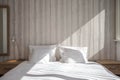 Bed made-up with clean white pillows and bed sheets in beauty room. Close-up. Lens flair in sunlight. Royalty Free Stock Photo