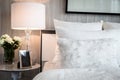 Bed maid-up with clean white pillows and bed sheets in beauty room. Close-up. Lens flair in sunlight. Royalty Free Stock Photo