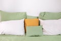 Bed maid-up with clean white pillows and bed sheets. Colorful Pillows on hotel bed Royalty Free Stock Photo