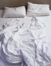 Bed Mattress Pillows and Blanket messed up Top view Royalty Free Stock Photo