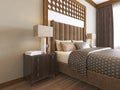 Bed in the Middle Eastern style with wooden carved headboard and bed Arabic textiles