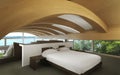 Bed in a minimalist room with panoramic windows. On the ceiling, the wooden design is perfectly curved, with large glass windows