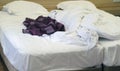 Bed with pillows and crumpled blanket. Crumpled blanket and pillows on empty rumpled bed in hotel room after sleeping in Royalty Free Stock Photo