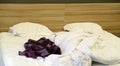 Bed with pillows and crumpled blanket. Crumpled blanket and pillows on empty rumpled bed in hotel room after sleeping in Royalty Free Stock Photo