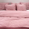 Bed with pink bedclothes Royalty Free Stock Photo