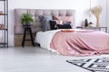 Bed with pink quilt cover Royalty Free Stock Photo