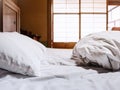 Bed sheets mattress with pillow Futon Japanese style room background Royalty Free Stock Photo