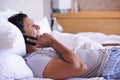 Bed, smile or phone call with a happy man to relax in communication, morning or connection. House, wake up and male Royalty Free Stock Photo