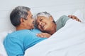 Bed, smile and senior couple with love, relax and marriage with retirement, relationship and conversation. Morning Royalty Free Stock Photo