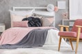 Bed with soft color bedsheets