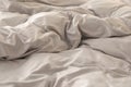 Bed with stylish silky linens, closeup view