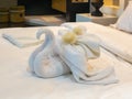 Bed Suite decorated with flowers and swan towel Royalty Free Stock Photo