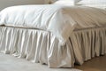 bed with a tailored cashmere bed skirt and highend sheets